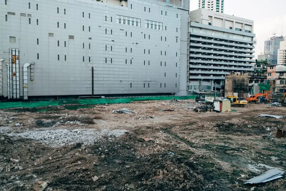 Machinery positioned for garage demolition and removal
