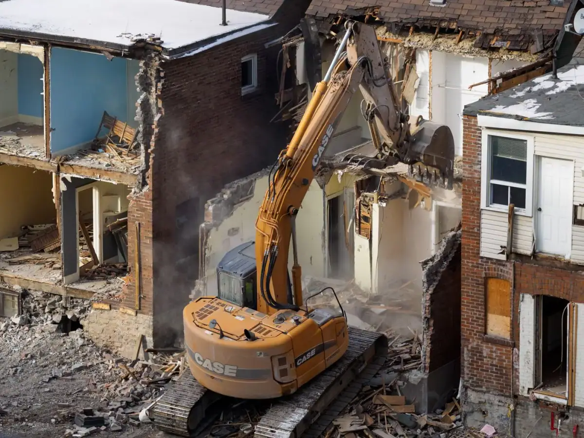 Excavator demolishing a house in North Carolina
